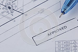 Approved engineering drawing documents with wrench.