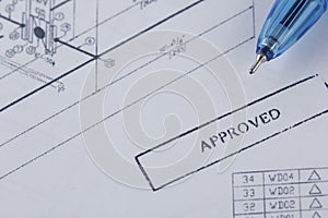 Approved engineering drawing documents with wrench. photo
