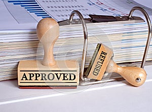 Approved and refused stamp on desk in the office
