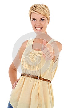 She approves. A pretty young woman giving you a thumbs up while isolated on a white background.