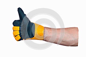 Approving gesture. Thumbs up. Man& x27;s hand in construction glove shows that everything is fine. Close-up.