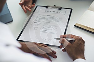 Approving and signing contracts concept photo