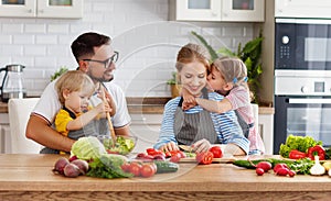 Appy family with child preparing vegetable salad