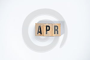 ` APR ` text made of wooden cube on  White background photo