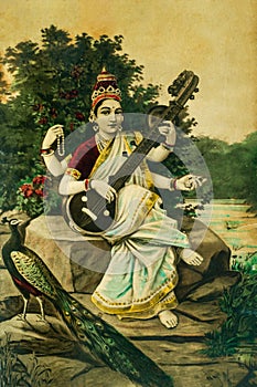 Vintage Painting of Goddess Saraswati , the Goddess of Learning is playing a Veena , India photo
