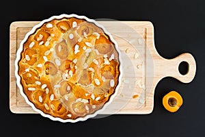 Apricot cake on wooden chopping board