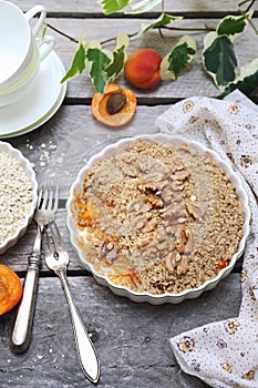 Apricot crumble from oatmeal, walnuts dressing for healthy breakfast