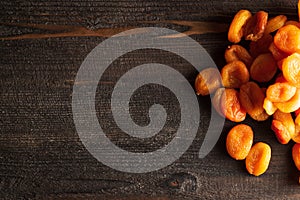 Apricot dried fruits on wooden dark background