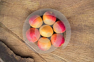 Apricot fruit. Fresh apricots on a wooden background. Close up flat lay photography
