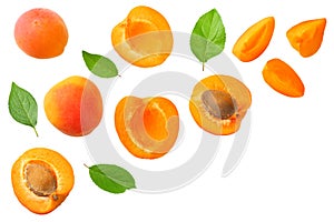 apricot fruits with slices and green leaf isolated on white background. top view