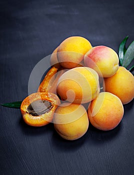 Apricot and halve with stone on dark background