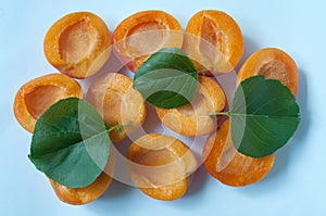 Apricot halves on a blue background