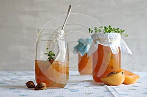 Apricot jam with thyme in a jar