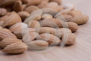 Apricot kernel on wooden plate