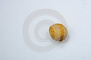 Apricot kernels on white background.