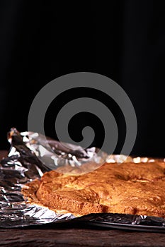 apricot pie baked in foil with ingredients cinnamon, abricot, eggs, flour, milk and sugar