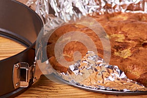 apricot pie baked in foil with ingredients cinnamon, abricot, eggs, flour, milk and sugar