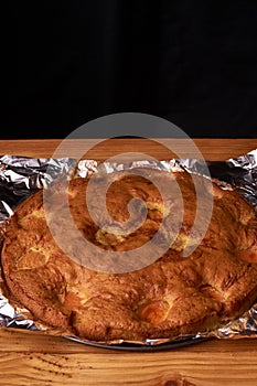 apricot pie baked in foil with ingredients cinnamon, abricot, eggs, flour, milk and sugar