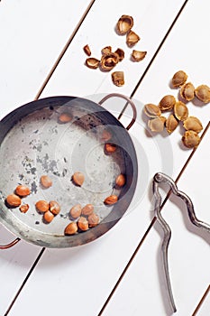 Apricot pits in a copper pot