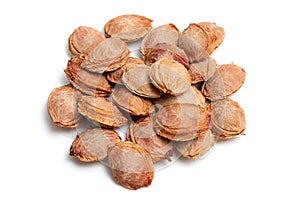 apricot pits on white isolated background