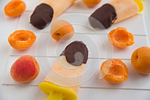 Apricot Popsicles dipped in dark chocolate
