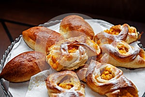 Apricot puff pastry and pies on a white napkin. Close-up, selective focus