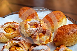 Apricot puff pastry and pies on a white napkin. Close-up, selective focus