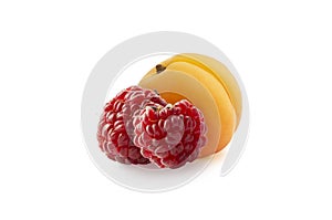 Apricot and raspberry on white. Sweet apricot with raspberries isolated on white background cutout