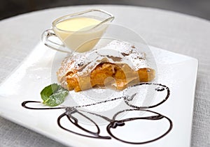Apricot strudel with custard and mint