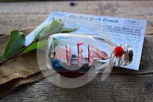 Apricot , tree, newspaper, leaves, ship, bottle, cloth