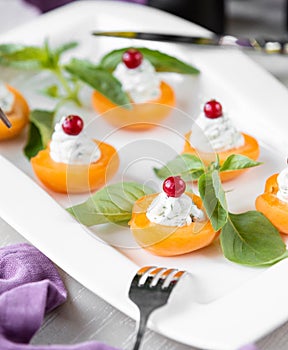 Apricote with cream and cranberry photo