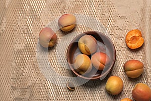 Apricots in a bowl on a light background