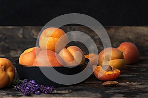 Apricots in a bowl on a wooden table