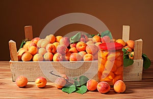 Apricots and compote in a jar of glass photo