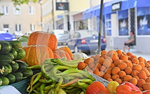 Apricots, hot peppers, squash and other fruit and vegetable for sale at local farmers market. Fresh organic produce for