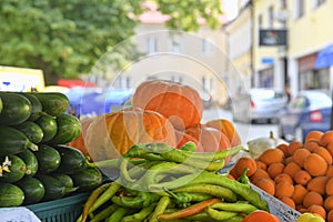 Apricots, hot peppers, squash and other fruit and vegetable for sale at local farmers market. Fresh organic produce for