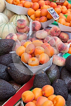 Apricots, peach, avocados, melons at fruit market