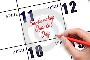 April 11. Hand writing text Barbershop Quartet Day on calendar date. Save the date.