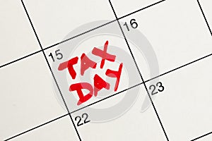 April 15th highlighted in red as Tax Day on a white calendar