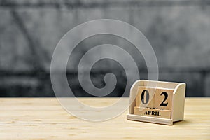 April 2 wooden calendar on vintage wood abstract background. using as background Universal day concept with copy space for your