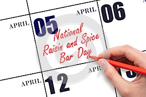 April 5. Hand writing text National Raisin and Spice Bar Day on calendar date. Save the date.