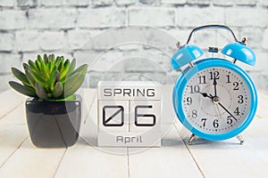 April 6 on the wooden calendar.The sixth day of the spring month, a calendar for the workplace. Spring