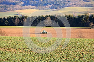 April 7 2018 - Saxony, Germany: a Tractor working on the farm, a modern agricultural transport, a farmer working in the field,