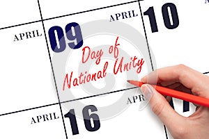 April 9. Hand writing text Day of National Unity on calendar date. Save the date.