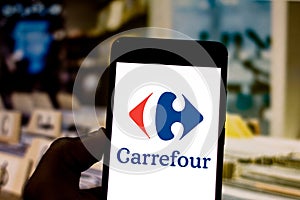 April 1, 2019, Brazil. Carrefour logo on the mobile device. Carrefour is an international network of hypermarkets, with photo