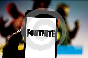 April 1, 2019, Brazil. Fortnite logo on the screen of the mobile device. Fortnite is an online multiplayer online game developed