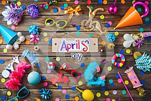 April Fools' Day Celebration with Prankster's Toolkit and Festive Decorations on Wooden Background photo