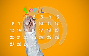 April fools day. Hand traces 1 number on the calendar