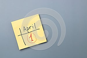 April fools day reminder on yellow sticky note. be aware and do not let be fooled