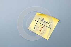 April fools day reminder on yellow sticky note in form of calendar. be aware and do not let be fooled